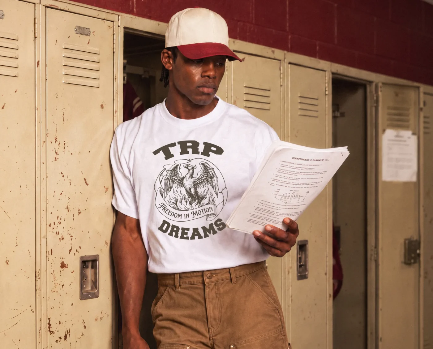 White TRP Dreams t-shirt with a phoenix graphic reading Freedom in Motion