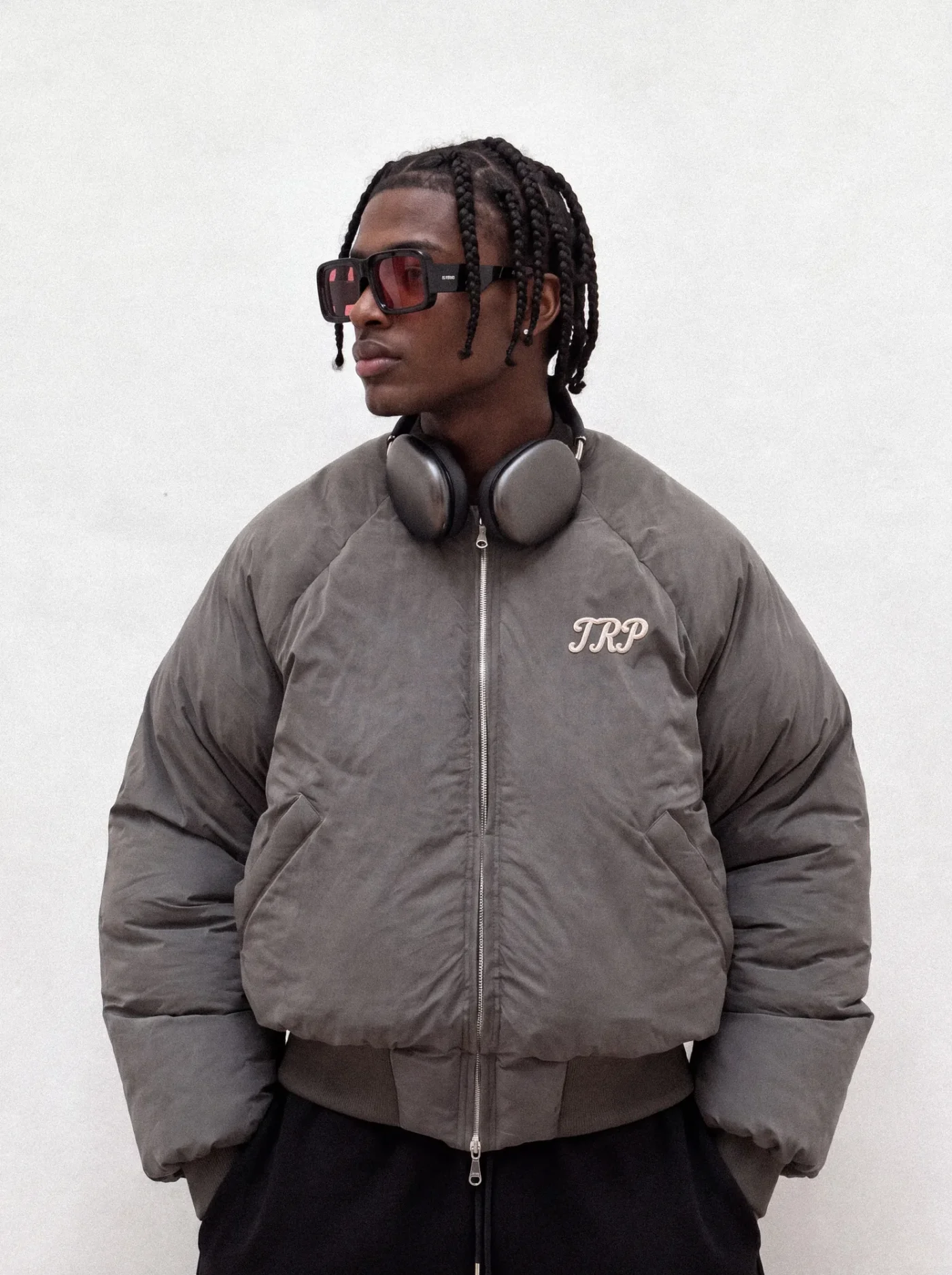 Charcoal TRP puffer bomber jacket with a script logo