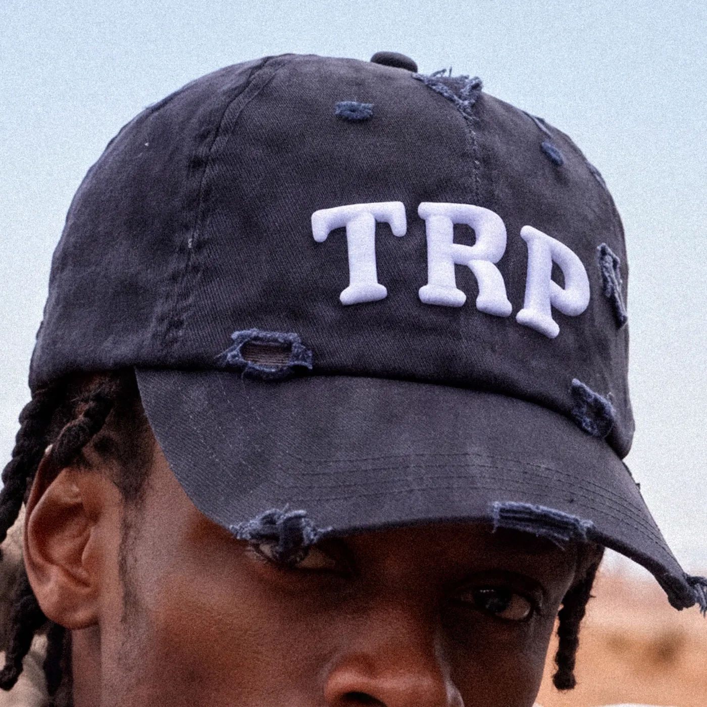 Distressed navy cap with white TRP letters